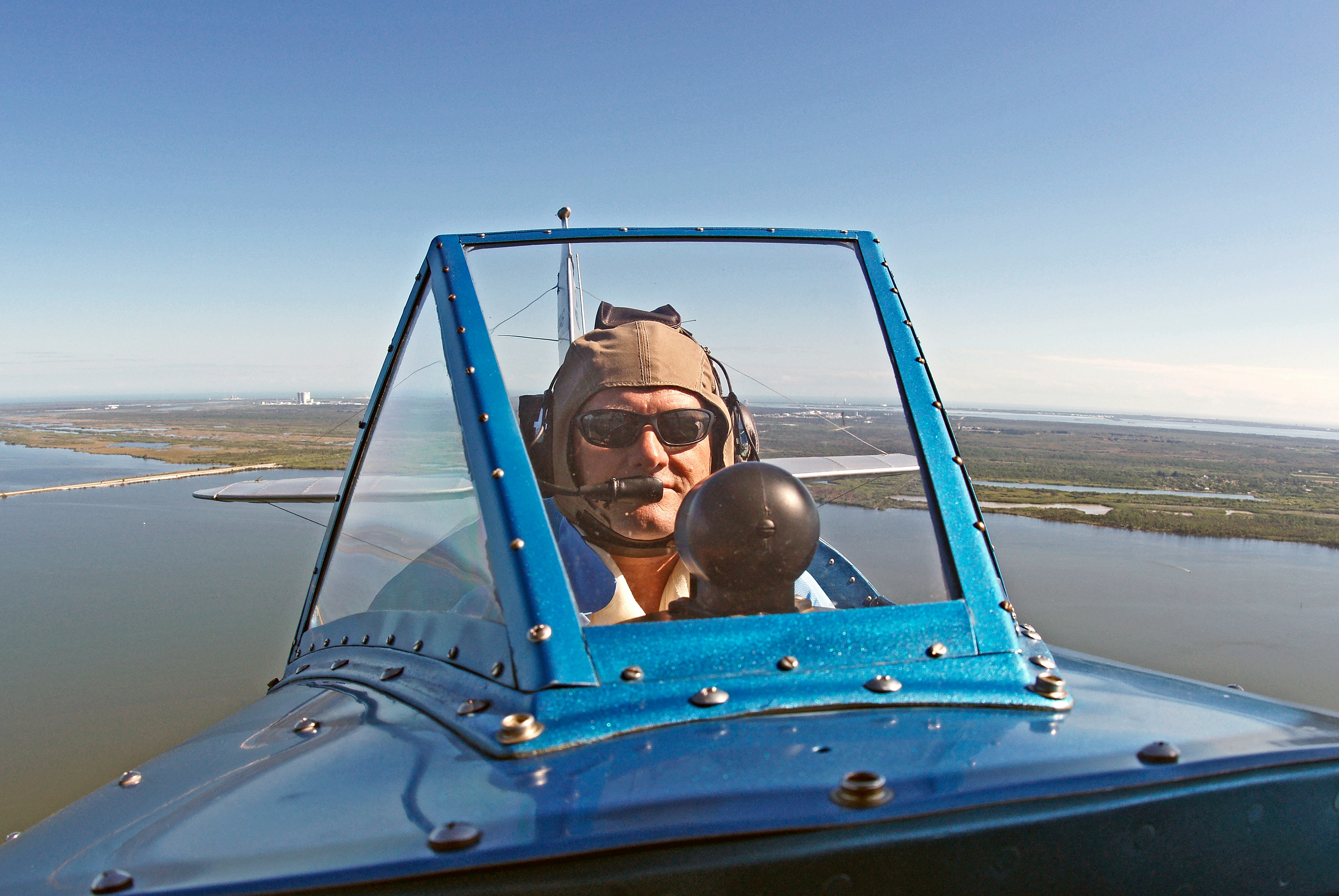 Pilot confidently flying a small airplane